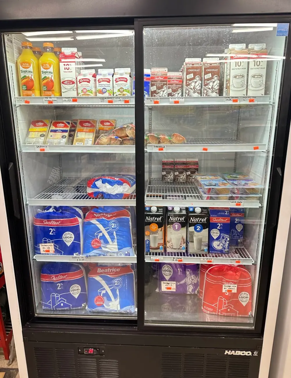 Refrigerated display with milk, eggs, juice and sandwiches
